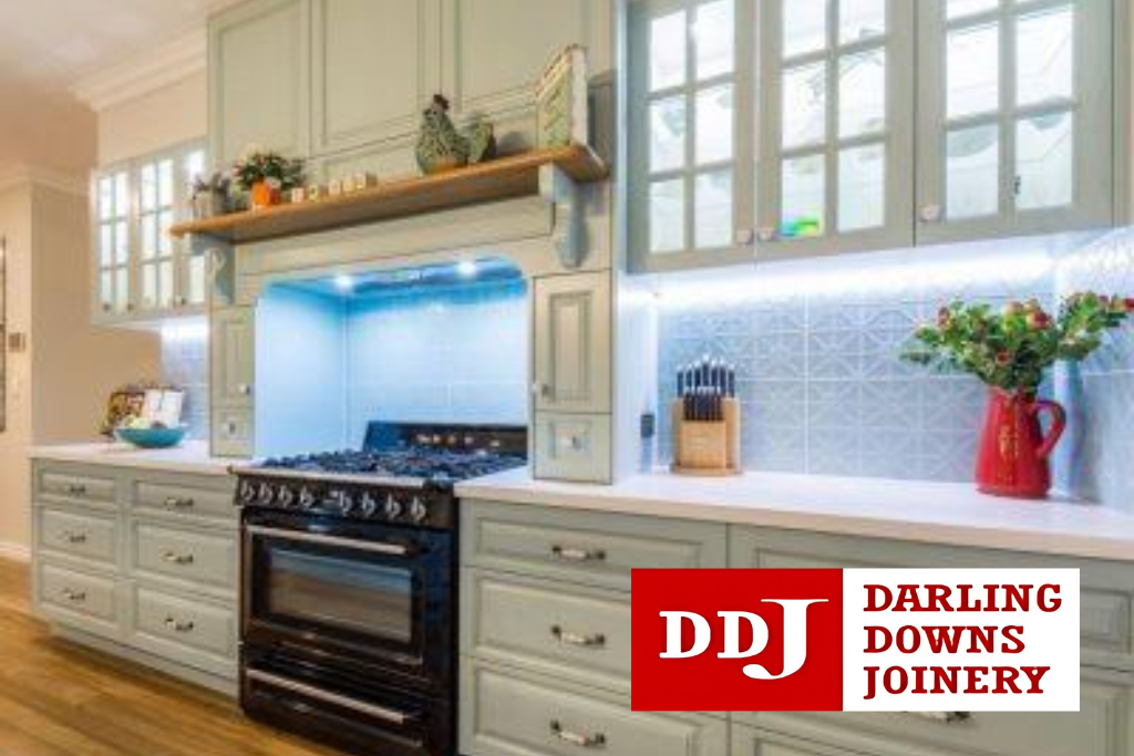 Modern white custom kitchen with minimalist cabinetry and a large island bench.